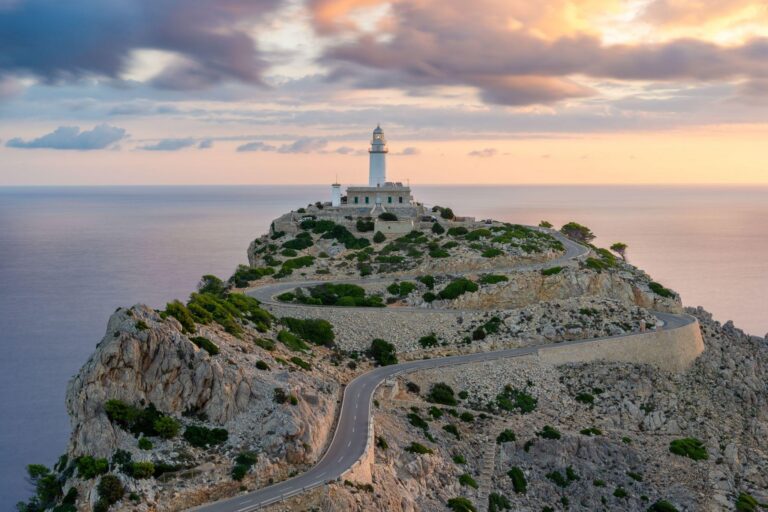 The Formentor Lighthouse located on the northernmost tip of Mallorca, Spain is perched on a spectacular cliff 200 meters above sea level at Cap de Formentor.