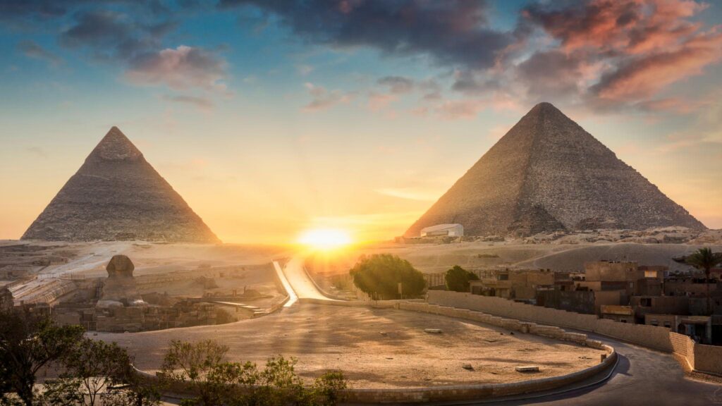Great Sphinx, Pyramid of Khafre and Great Pyramid of Giza at sunset, Cairo, Giza, Egypt.