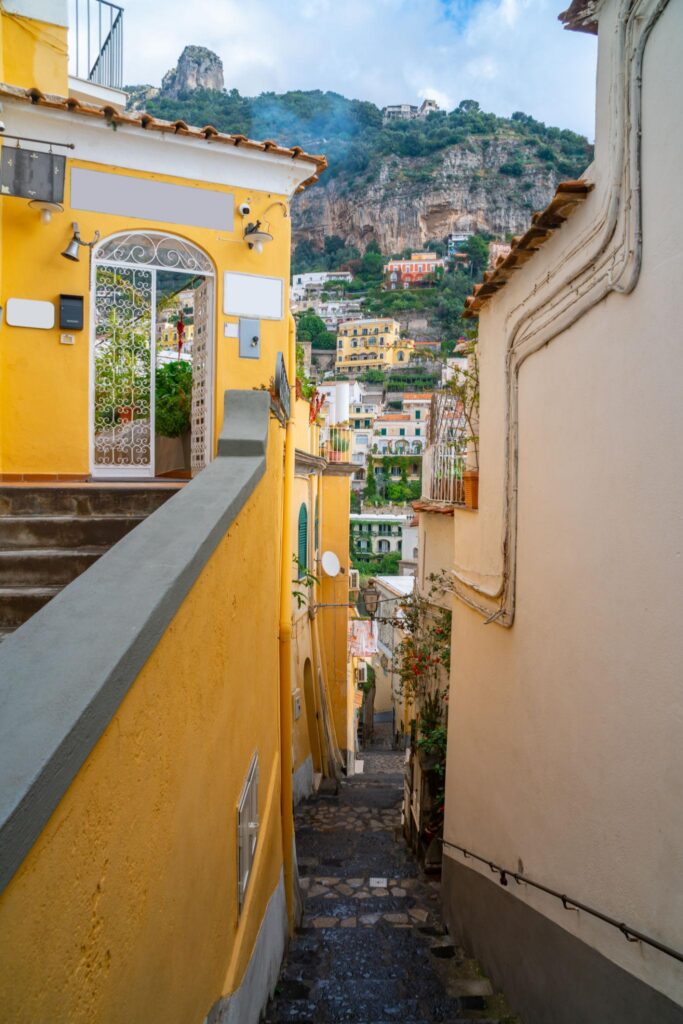 Narrow street and colorful houses in city of Positano, Amalfi coast.
