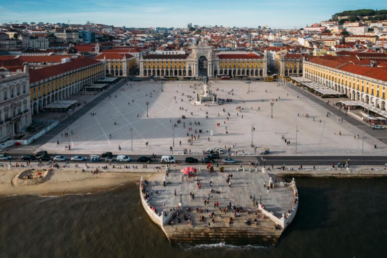 Pedestrians at Praca do Comercio in Lisbon, Portug