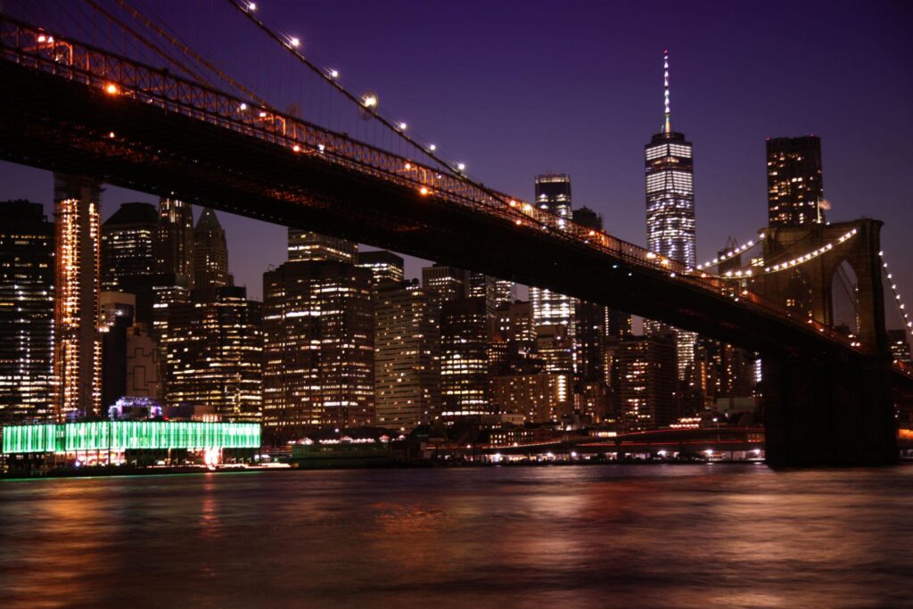View of night scene of the Brooklyn bridge and Manhattan Skyline at Night,