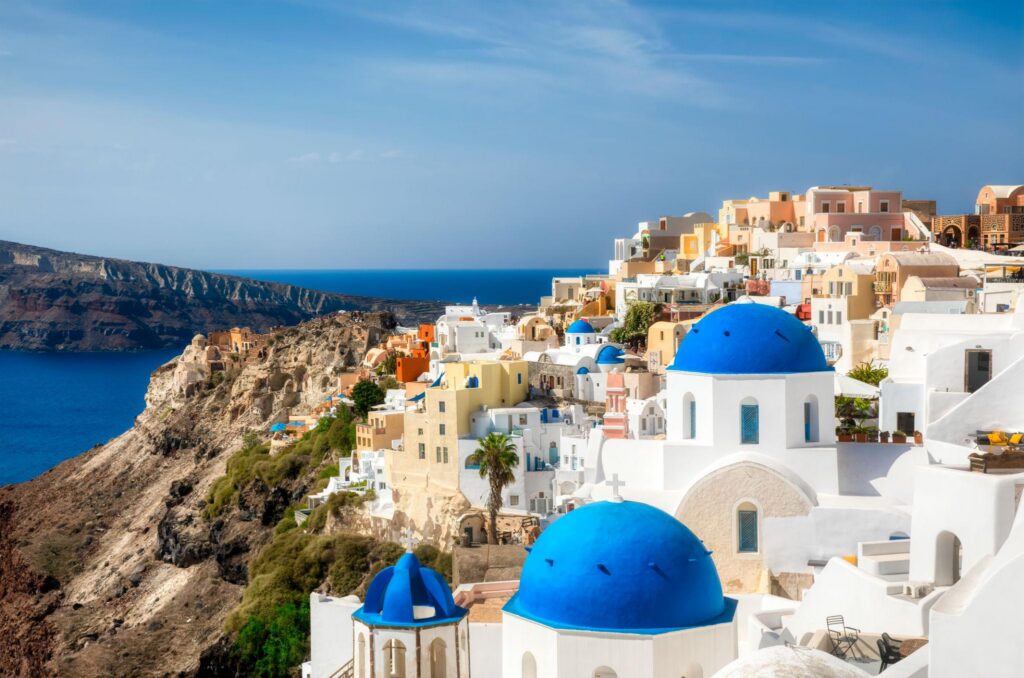 The famous Blue Domes in the beautiful Village of Oia on Santorini, Greece.