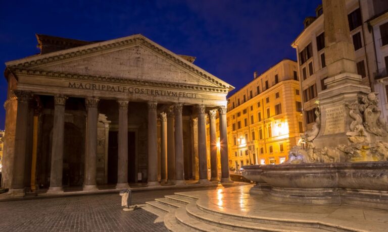 The historic Pantheon, a remarkably preserved ancient Roman temple dedicated to ALL THE GODS, in Rome, Italy, featuring a fountain and obelisk in the foreground at night.