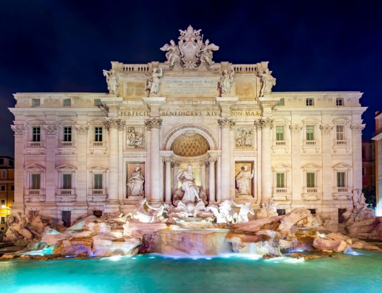 Trevi Fountain in Rome, Italy, a Baroque masterpiece featuring Neptune and sea horses wher visitors toss coins over their left shoulder into the basin to ensure a return to the city.