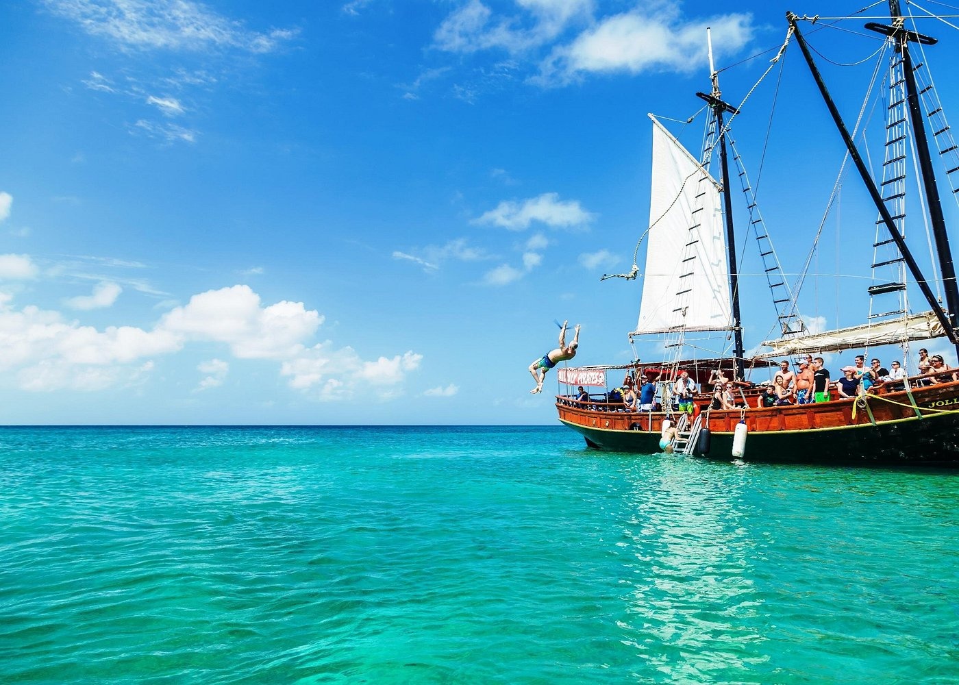 Jolly Pirates teak schooners are known for their distinct pirate ship design and rope swings. Tourists can enjoy snorkeling, a barbecue lunch, and an open bar during these four-hour excursions in Aruba.