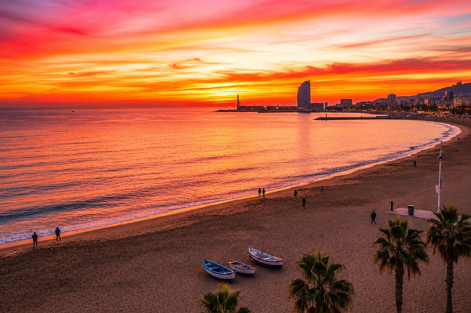 A spectacular sunset over Barceloneta Beach in Barcelona, Spain, with the iconic W Barcelona hotel visible on the horizon.