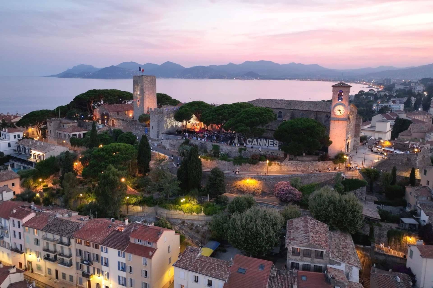 Le Suquet district, the old town area of Cannes on the French Riviera feauturing a large white sign reading CANNES, a popular spot for visitors to take photos.