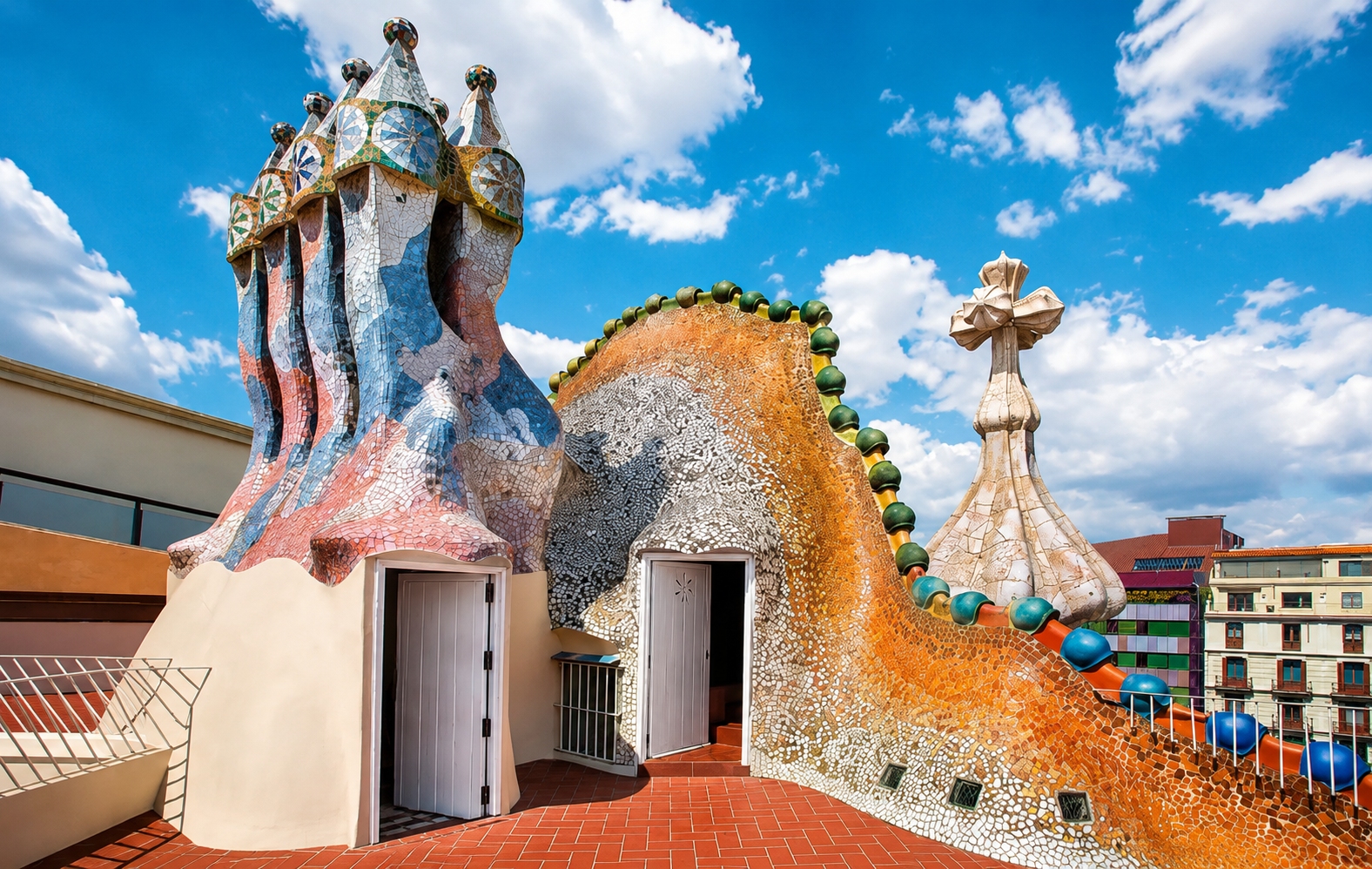 The roof of Casa Batllo in Barcelona, designed by the architect Antoni Gaudi, featuring his signature colorful tile work featuring The Dragon's Back, The Swordand and The Chimneys.