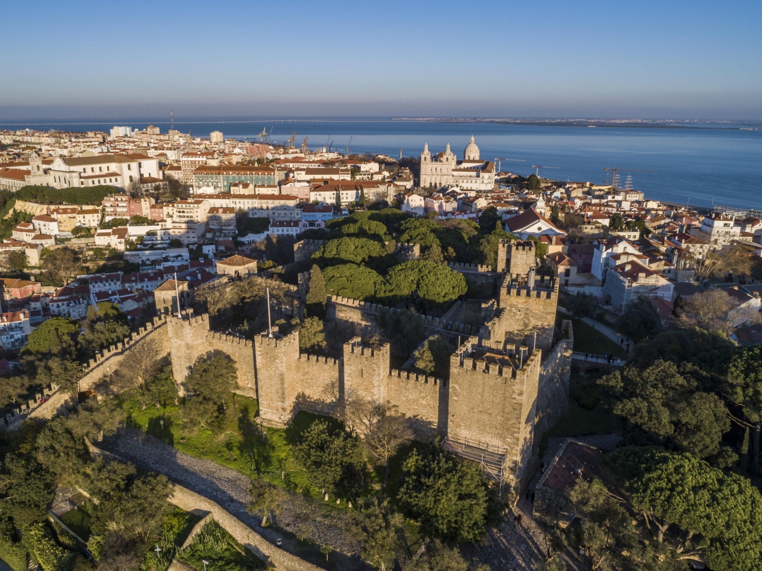 Castelo de Sao Jorge in Lisbon, Portugalis a historic hilltop fortress featuring iconic stone walls and towers.