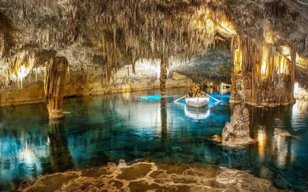 The illuminated Cuevas del Drach (Drach Caves) in Porto Cristo, Mallorca, Spain.