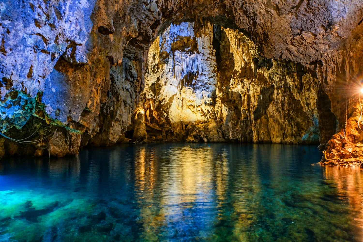 The Emerald Grotto, a sea cave famous for its vibrant green water, which is caused by sunlight filtering through an underwater fissure is located in Conca dei Marini on the Amalfi Coast of Italy.