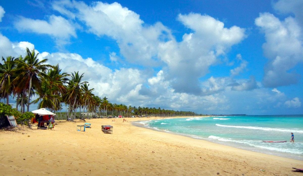 Playa Macao, or Macao Beach, in the Dominican Republic, known for its scenic views and sandy shores is a popular spot for activities like boogie boarding and surfing due to its larger breakers.