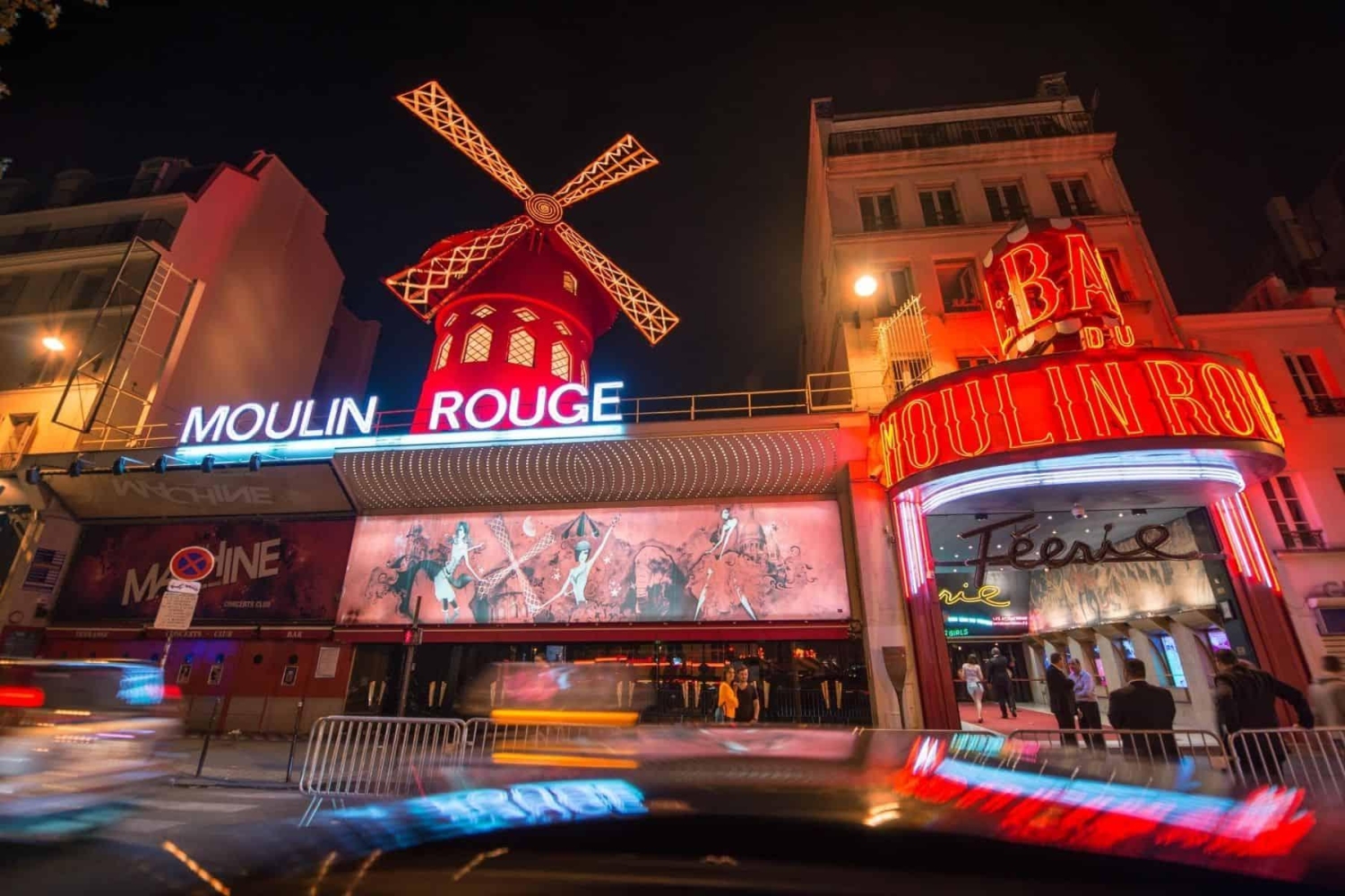 The iconic Moulin Rouge cabaret located in the Montmartre district of Paris is famous for its large red windmill, or moulin, and for hosting the French can-can dance since it opened in 1889.