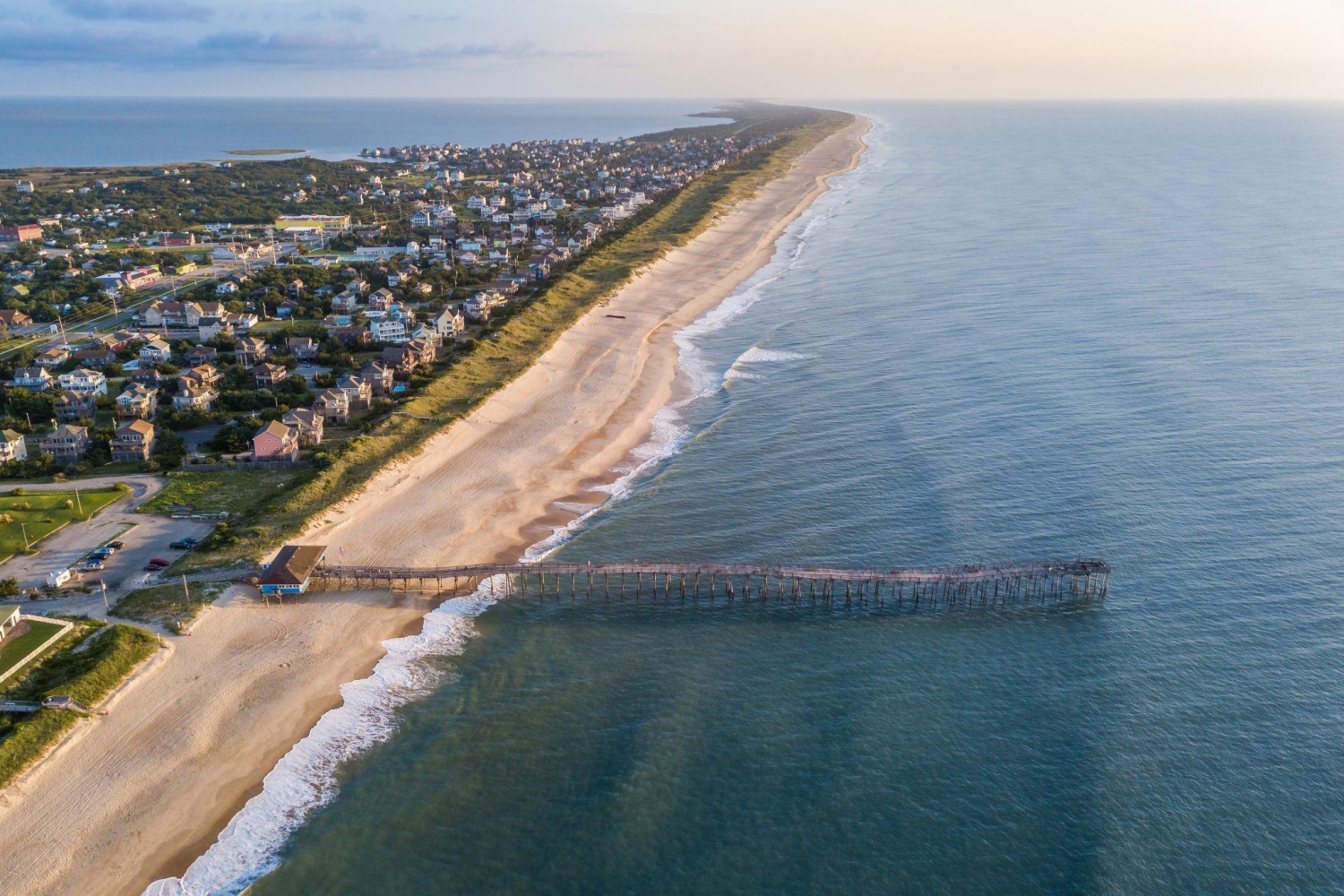 Avon Fishing Pier extending into the Atlantic Ocean from the sandy shores of Hatteras Island in North Carolina.