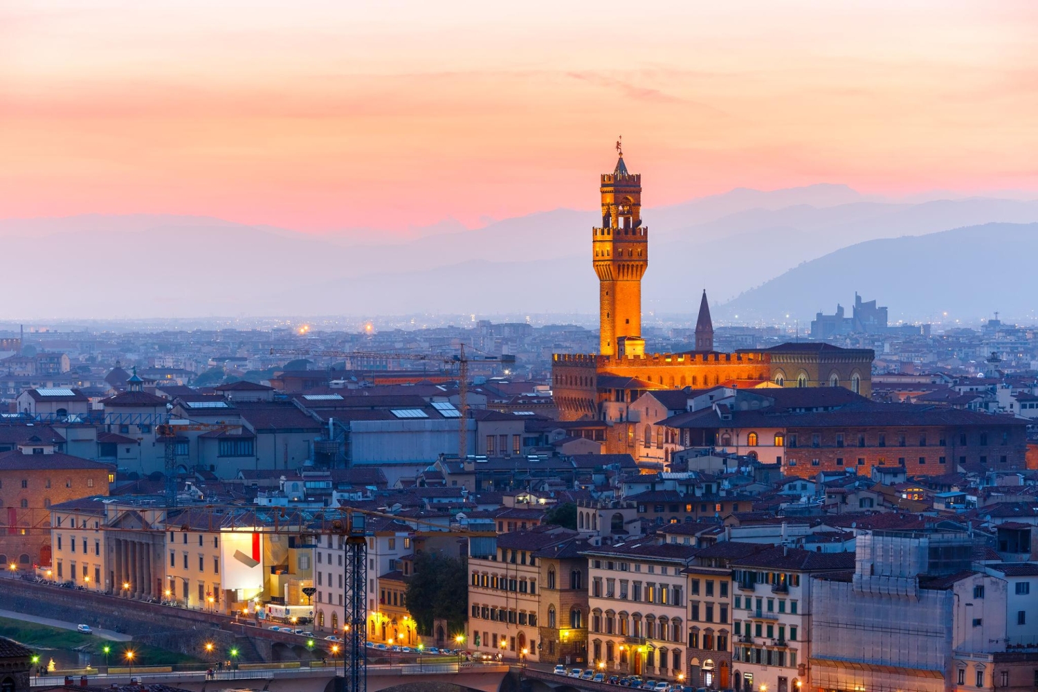 Palazzo Vecchio, the town hall of Florence, Italy, illuminated at sunset.