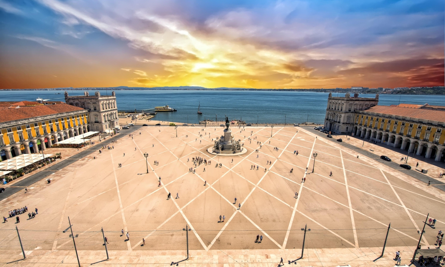 The Praca do Comercio in Lisbon, Portugal, known for its iconic yellow buildings and riverside setting Featuring a prominent statue of Dom Jose I in its center.