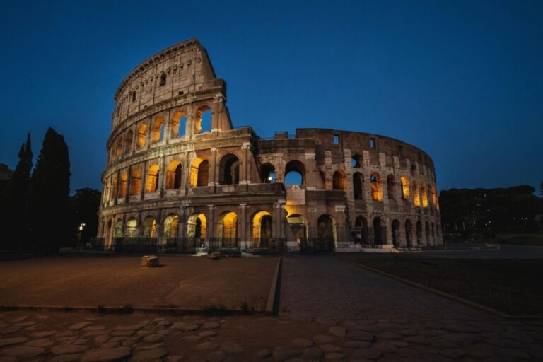 The majestic Colosseum of Rome on a warm summer night.