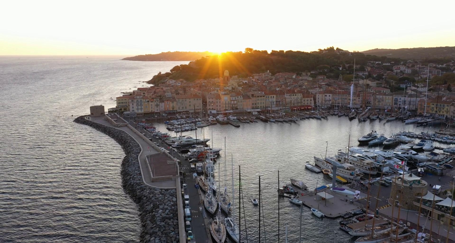 The historic port of Saint-Tropez, a renowned coastal town on the French Riviera famous for docking luxury yachts and sailing boats, especially during events like Les Voiles de Saint-Tropez.