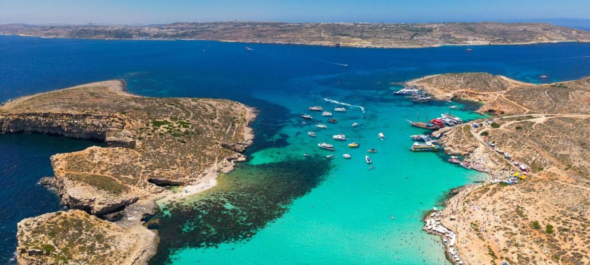 A major tourist attraction, often described as a blue gem of the Maltese archipelago, the Blue Lagoon is renowned for its shallow, crystal-clear turquoise waters and rocky coastline, making it a popular spot for swimming and snorkeling.